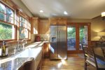 The kitchen has natural light and nice stainless appliances